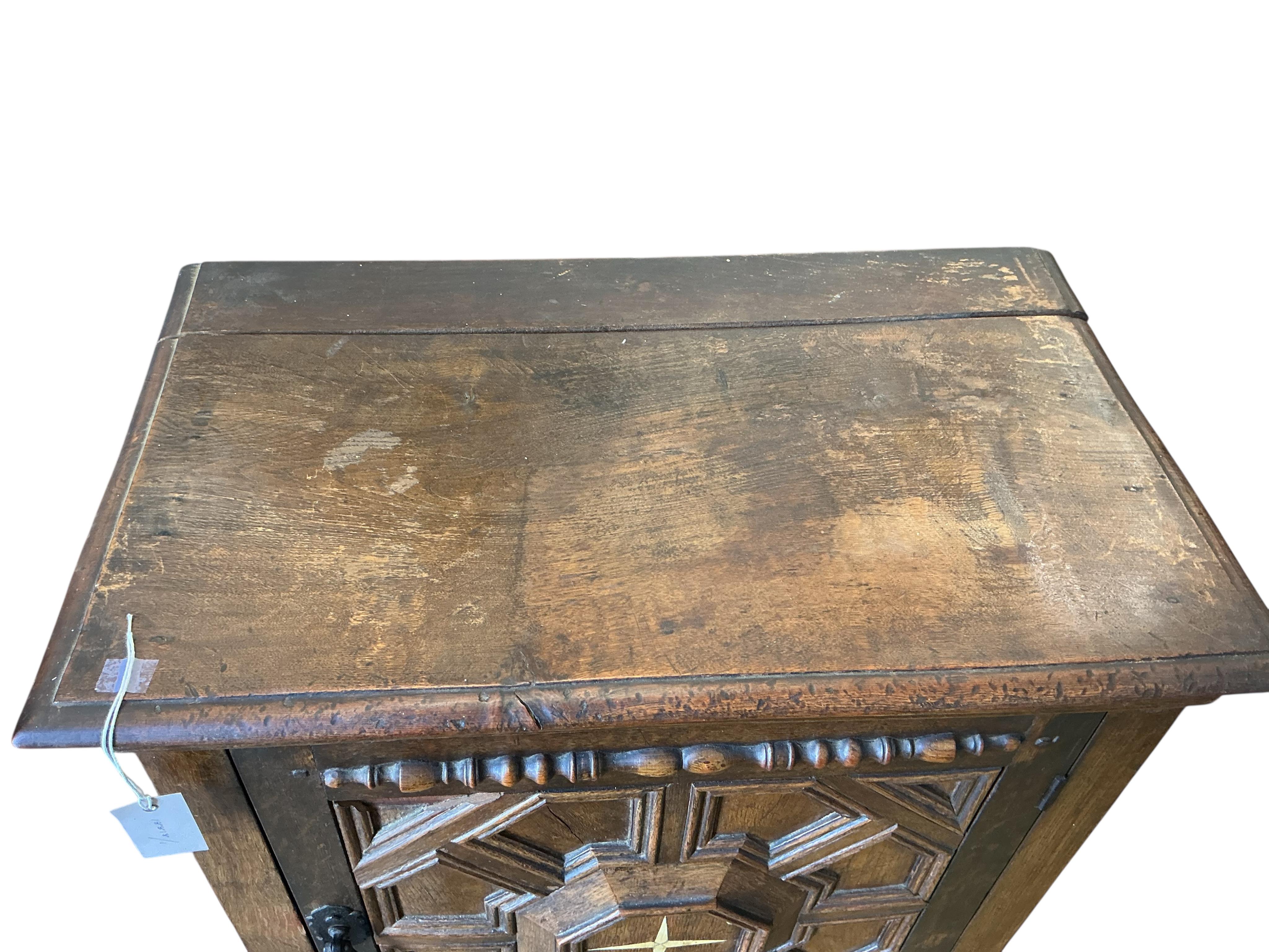 A 17th century style oak cabinet on stand, width 64cm, depth 39cm, height 120cm